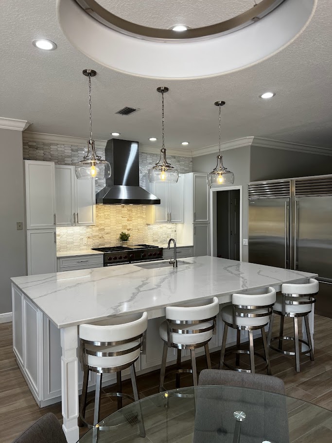 Kitchen remodel featuring large island with pendant lights in Sarasota FL