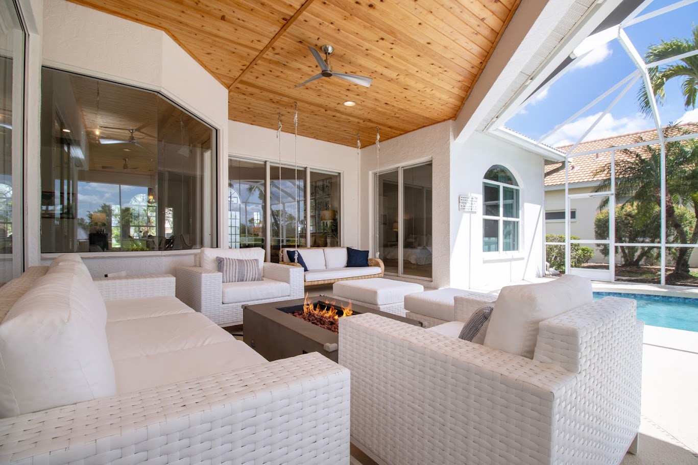 Covered patio with fire pit built by Eminence Services in Sarasota FL